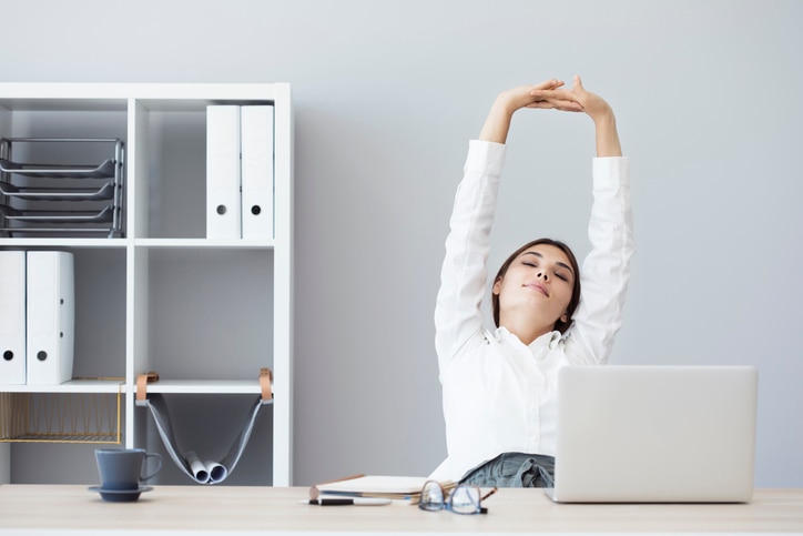 Young business woman stretching