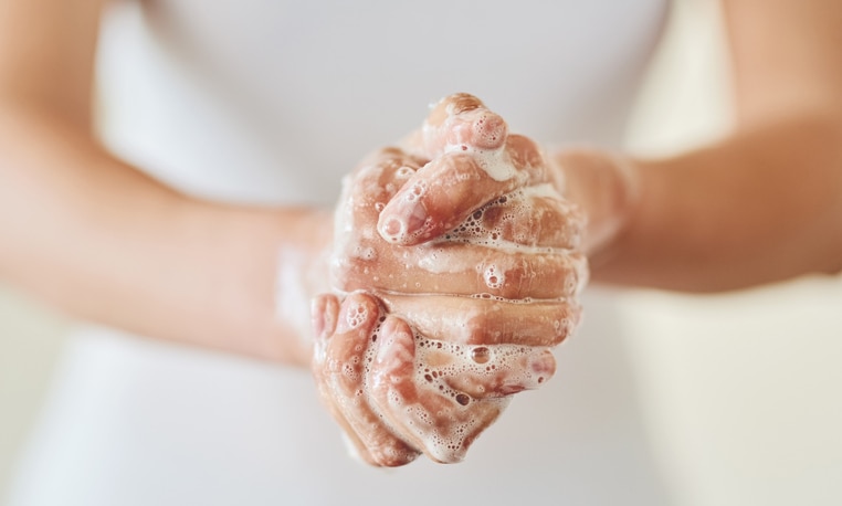 Closeup shot of a woman washing her hands with soap