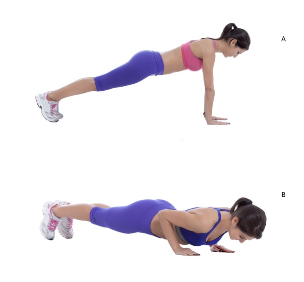 Come into plank position with your arms and legs straight, shoulders above the wrists. (A) Take a breath in and as you exhale, bend your elbows out to the sides and lower your chest toward the ground. Stop as soon as your shoulders are in line with your elbows. (B)