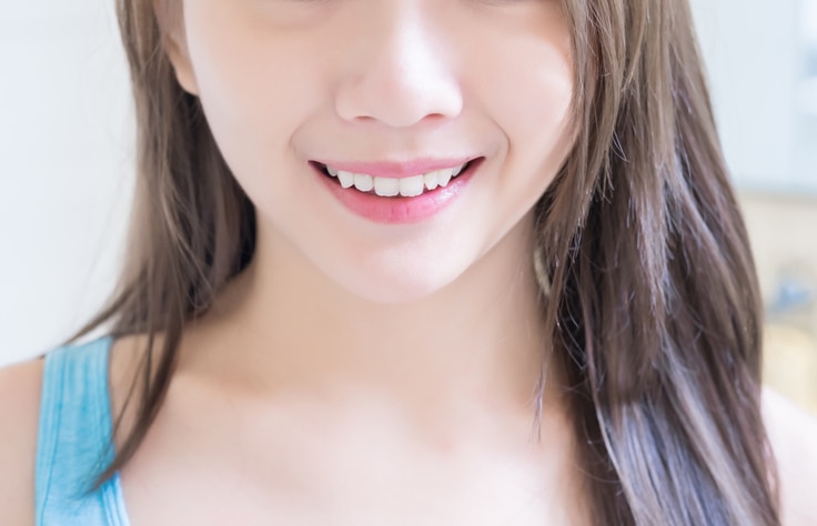 close up of beauty woman with health teeth and charming smile