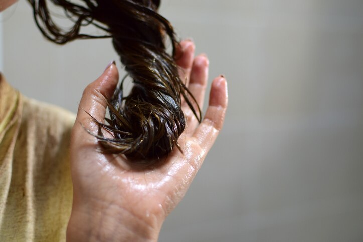 Female hand with dyed hair