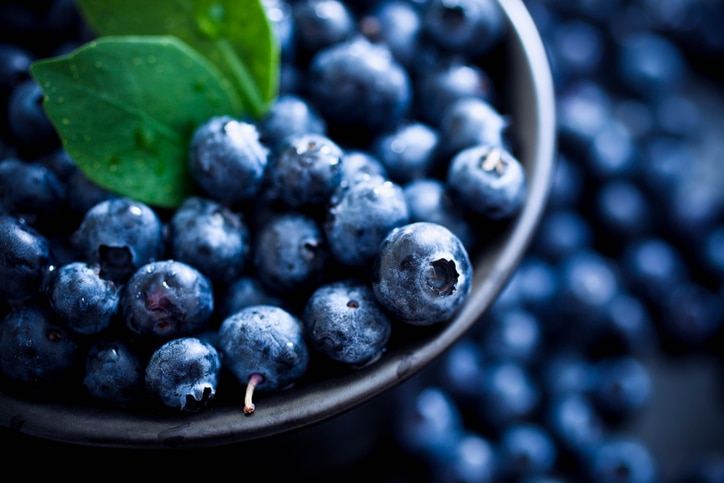 Blueberries with leaves. Selective focus