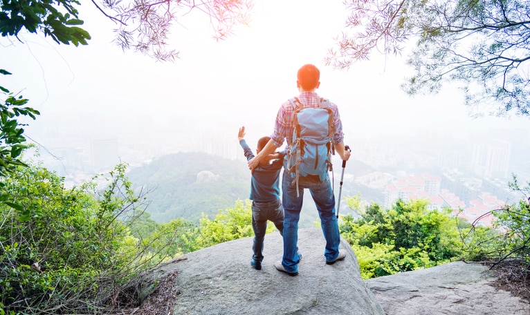 Father and son on the top of the hill