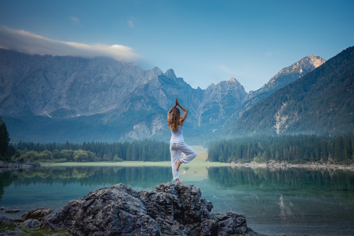 Beautiful woman doing yoga outdoor