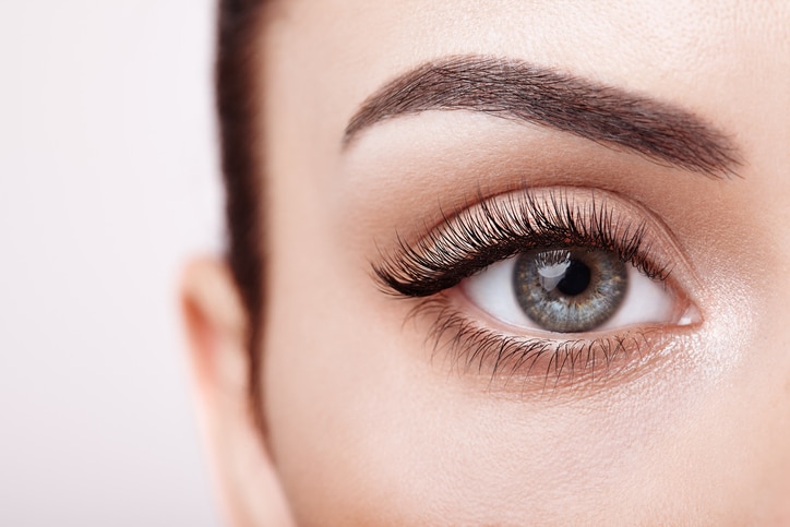 Female Eye with Extreme Long False Eyelashes. Eyelash Extensions. Makeup, Cosmetics, Beauty. Close up, Macro