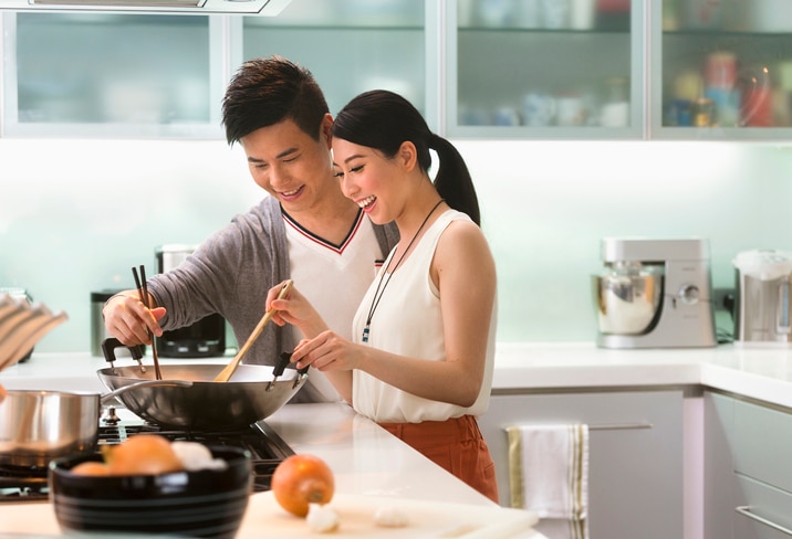 A Chinese couple in the kitchen.