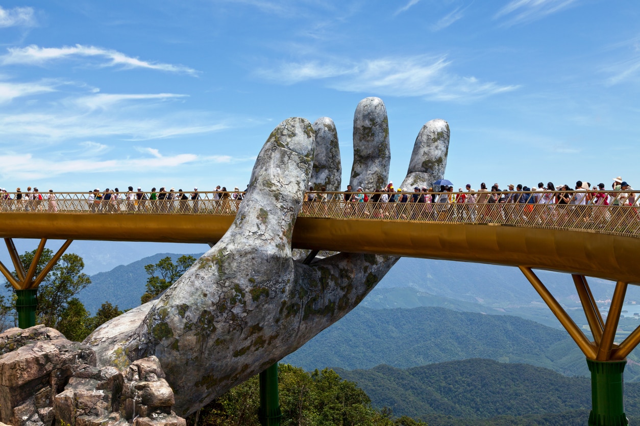 Bà Nà Hills, Vietnam - August 22 2018: The Golden Bridge is a 150 m long pedestrian bridge in the Bà Nà Hills, near Da Nang, Vietnam. The Bà Nà Hills are located in the Truong Son Mountains, which are part of the Annamite Range.