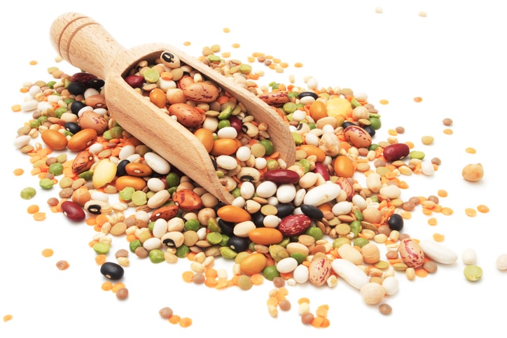 Dried legumes and cereals isolated on white background.