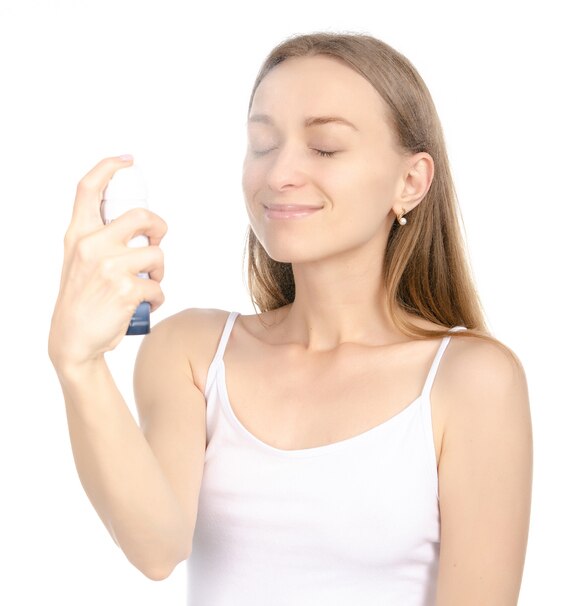 Beautiful woman beauty fashion thermal water spray for face in hand on white background isolation