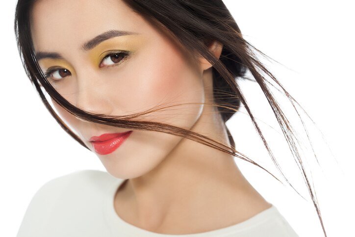 Beautiful young Asian woman portrait with fashionable makeup.